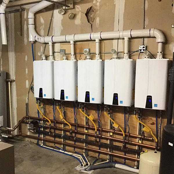 5 tankless water heater systems installed beside each other