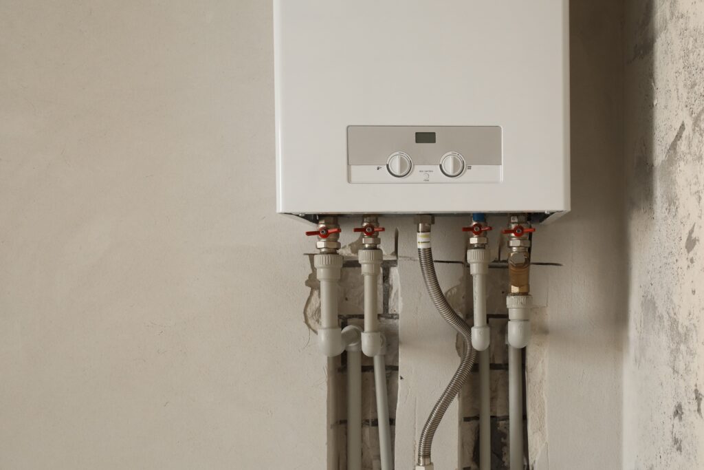 white tankless water heater installed in a san antonio home's garage
