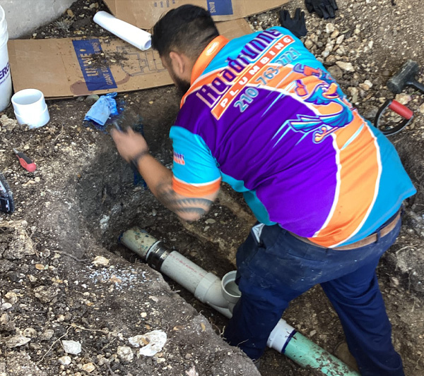 Roadrunner Plumbing technician working on sewer line repair