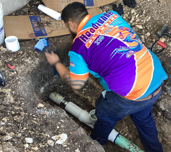 Roadrunner Plumbing & Air technician working on sewer line repair