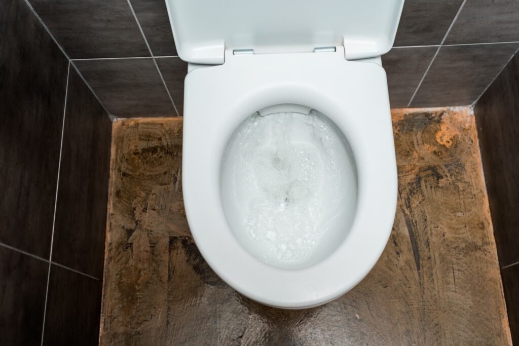 top view of a toilet flushing