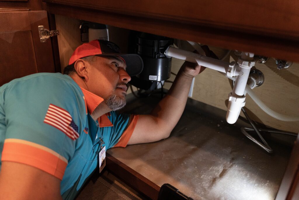 roadrunner plumber installing a water softener