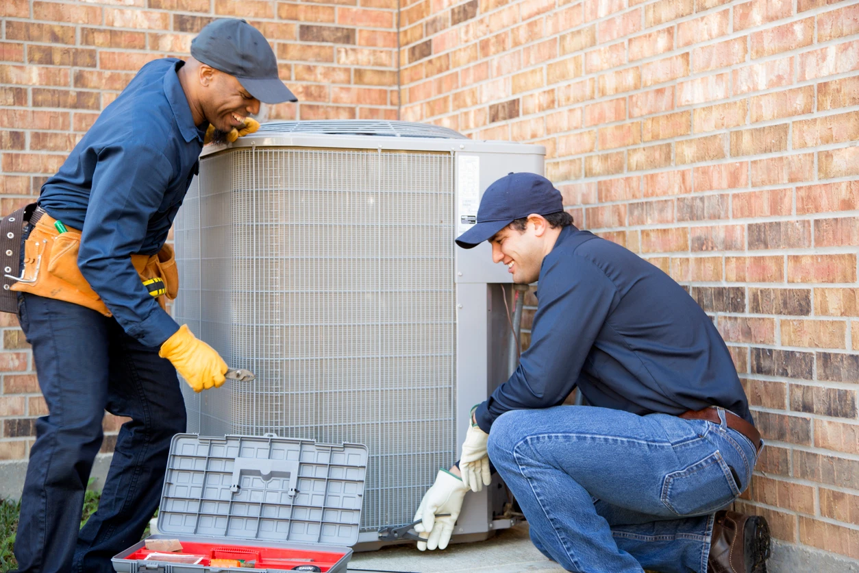 A technicians are engaged in fixing an air conditioning system