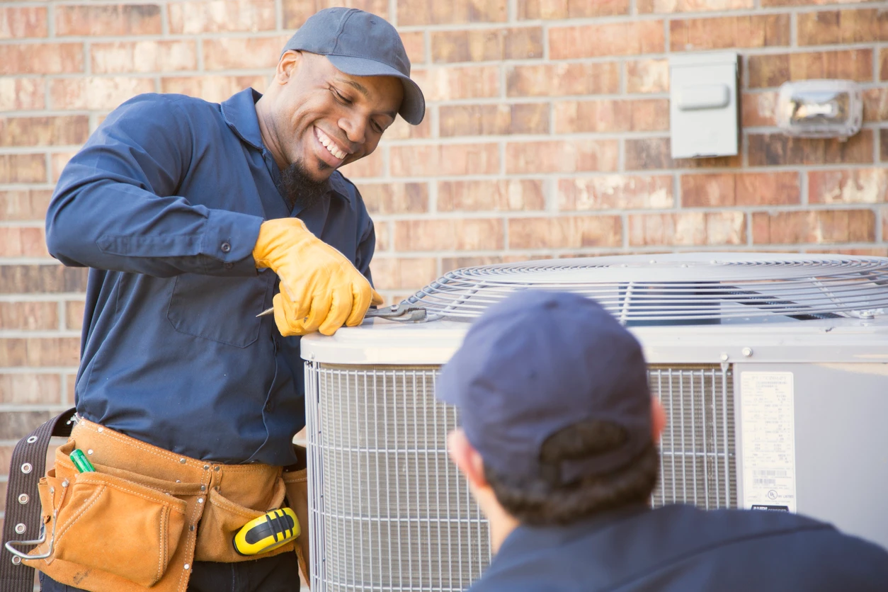 A technicians are engaged in fixing an air conditioning system