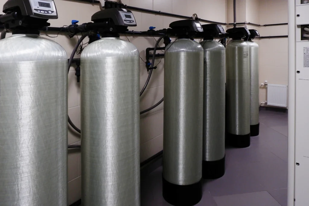 A water softener system connected to a water tank
